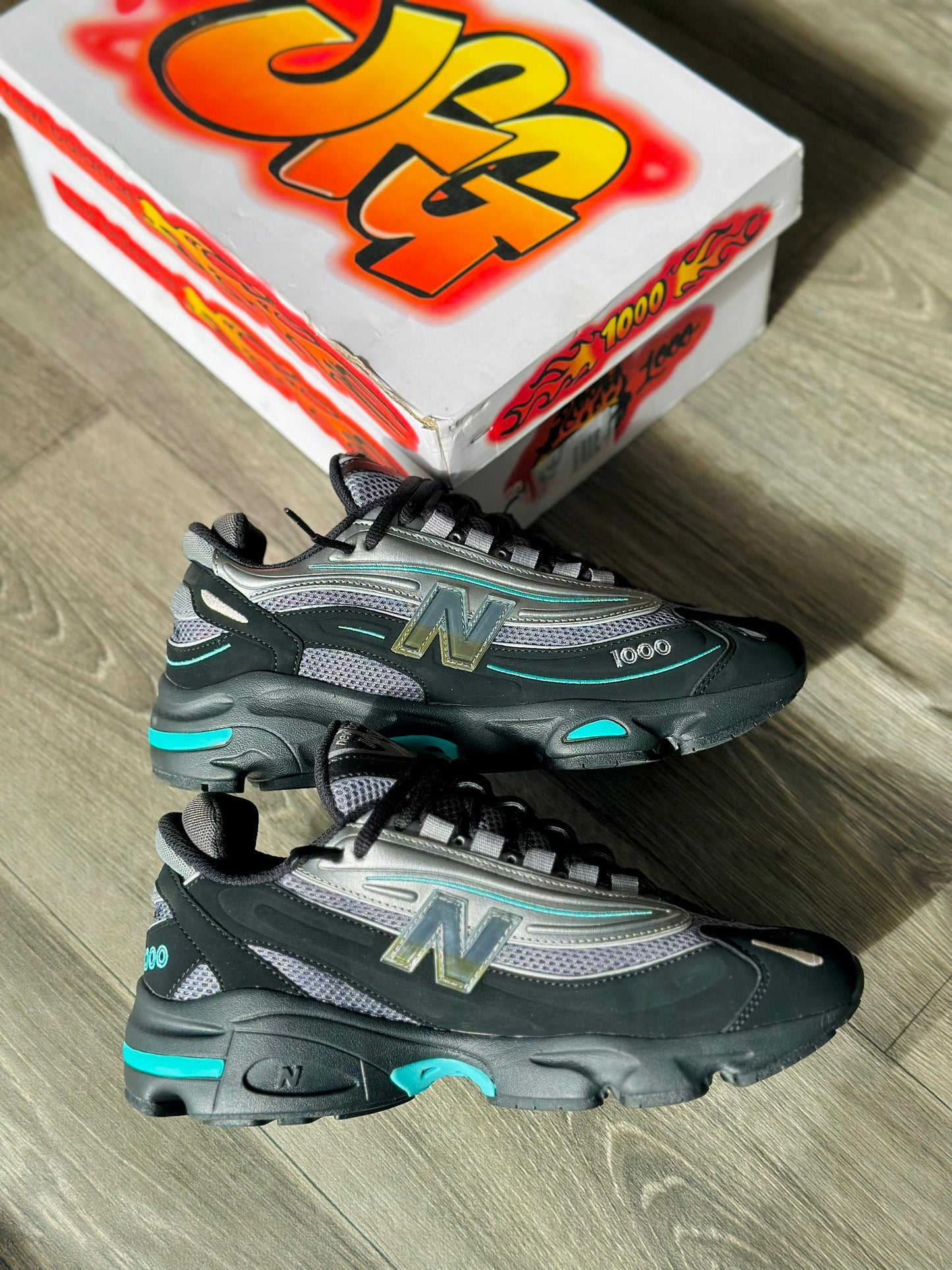 baskets New Balance 1000 'Black Teal' (ou 'Noir Sarcelle').